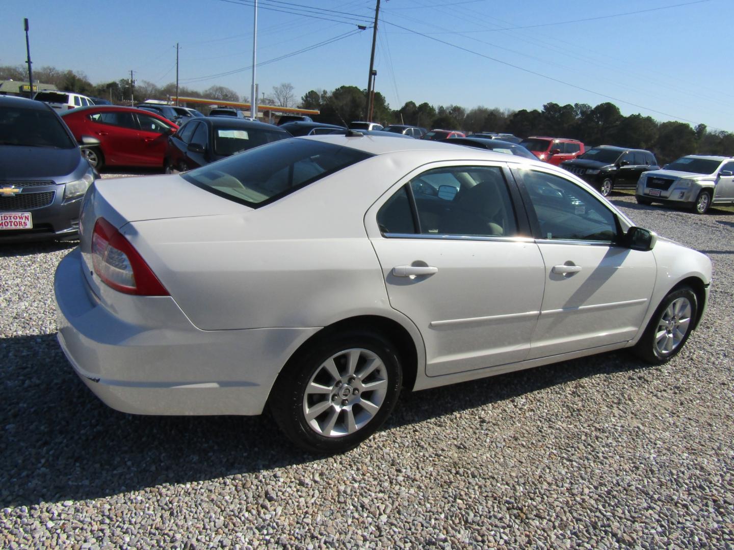 2009 CREAM /Tan Mercury Milan I4 (3MEHM07Z19R) with an 2.3L L4 DOHC 16V engine, Automatic transmission, located at 15016 S Hwy 231, Midland City, AL, 36350, (334) 983-3001, 31.306210, -85.495277 - Photo#7